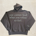 Brown hoodie with motivational text on the front.