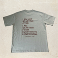 Gray t-shirt with motivational quote on the back
