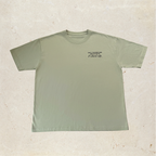 Sage green shirt with quote on the front